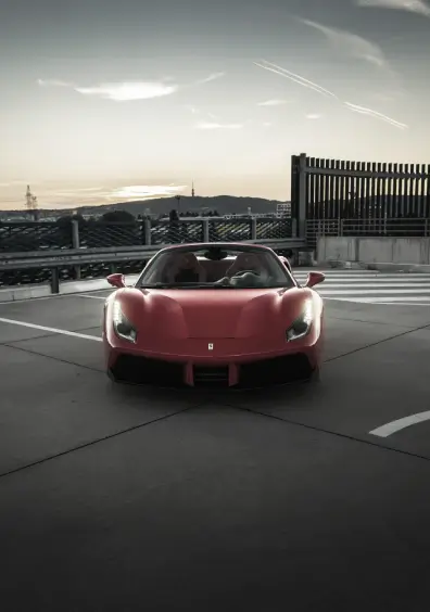 red Ferrari in sunset